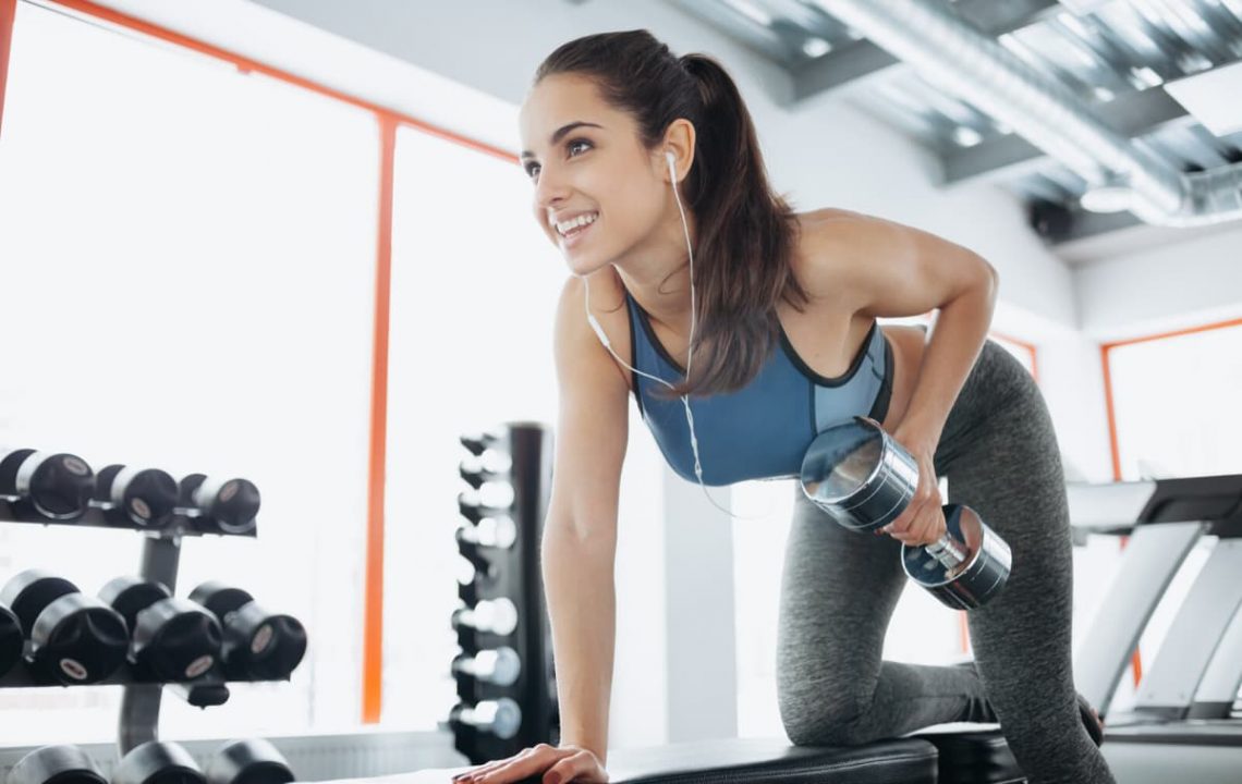 what to do if you miss a workout - girl doing dumbbell rows