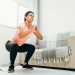 how to get up from the floor without using hands or knees - woman squatting to the ground feature image